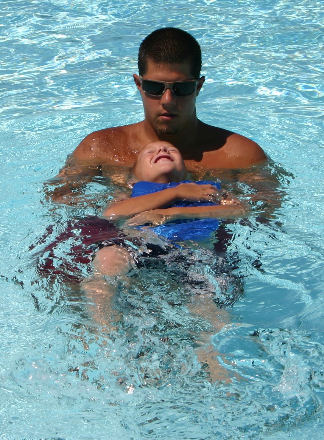 Swim instructor and child during swim lesson